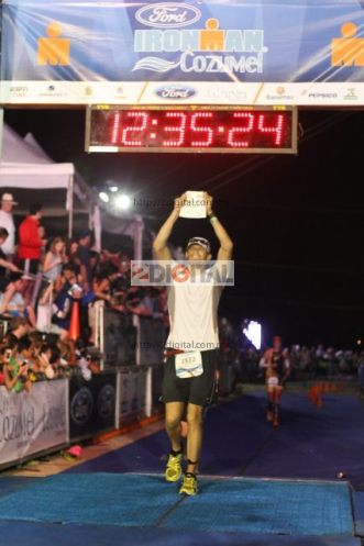 J crossing the finish line, beating his last Ironman finish time by 1 hour!